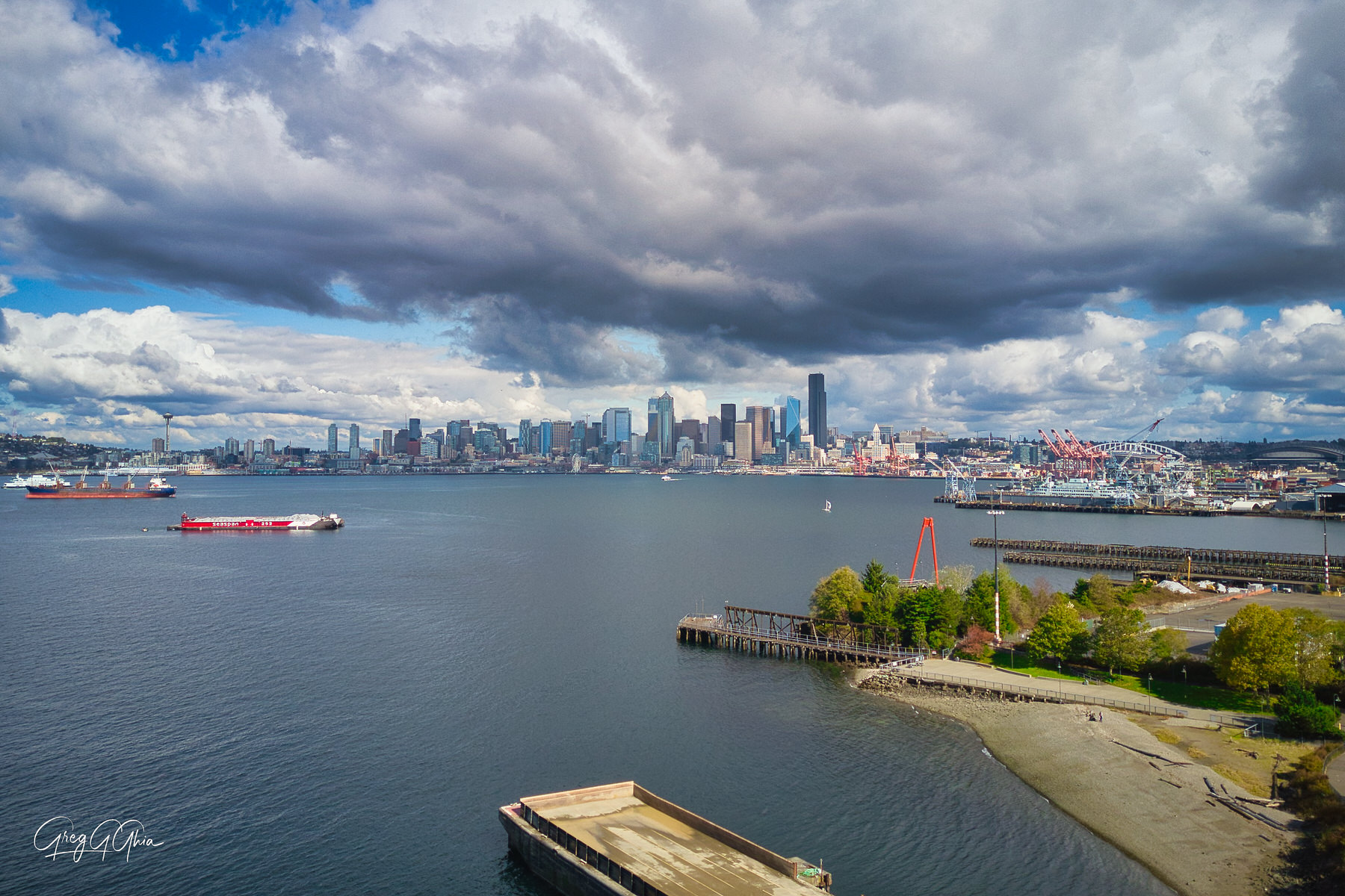 Downtown Seattle, WA and the Puget Sound (aerial view). The beaches along Harbor Avenue offer truly unique vantage points of...